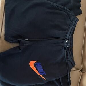Nike Kids Black Joggers with Orange and Blue Logo